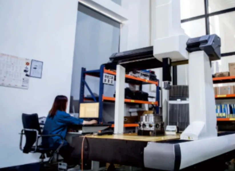 An engineer at a coordinate measuring machine