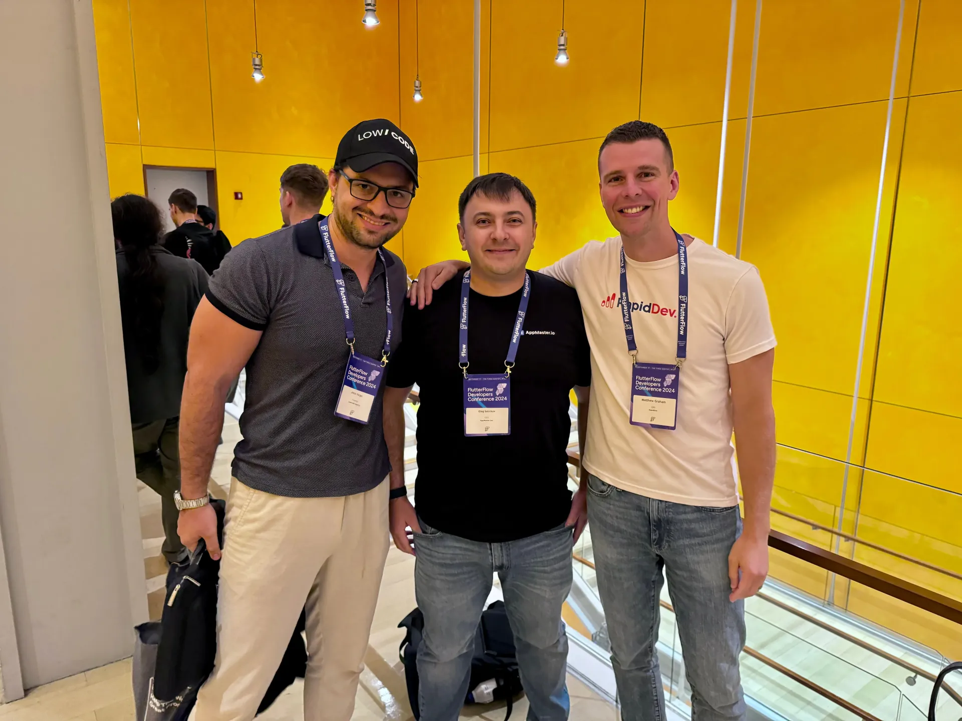 Oleg Sotnikov with Matt Graham of RapidDevs and fellow FlutterFlow partners at the FlutterFlow Developer Conference