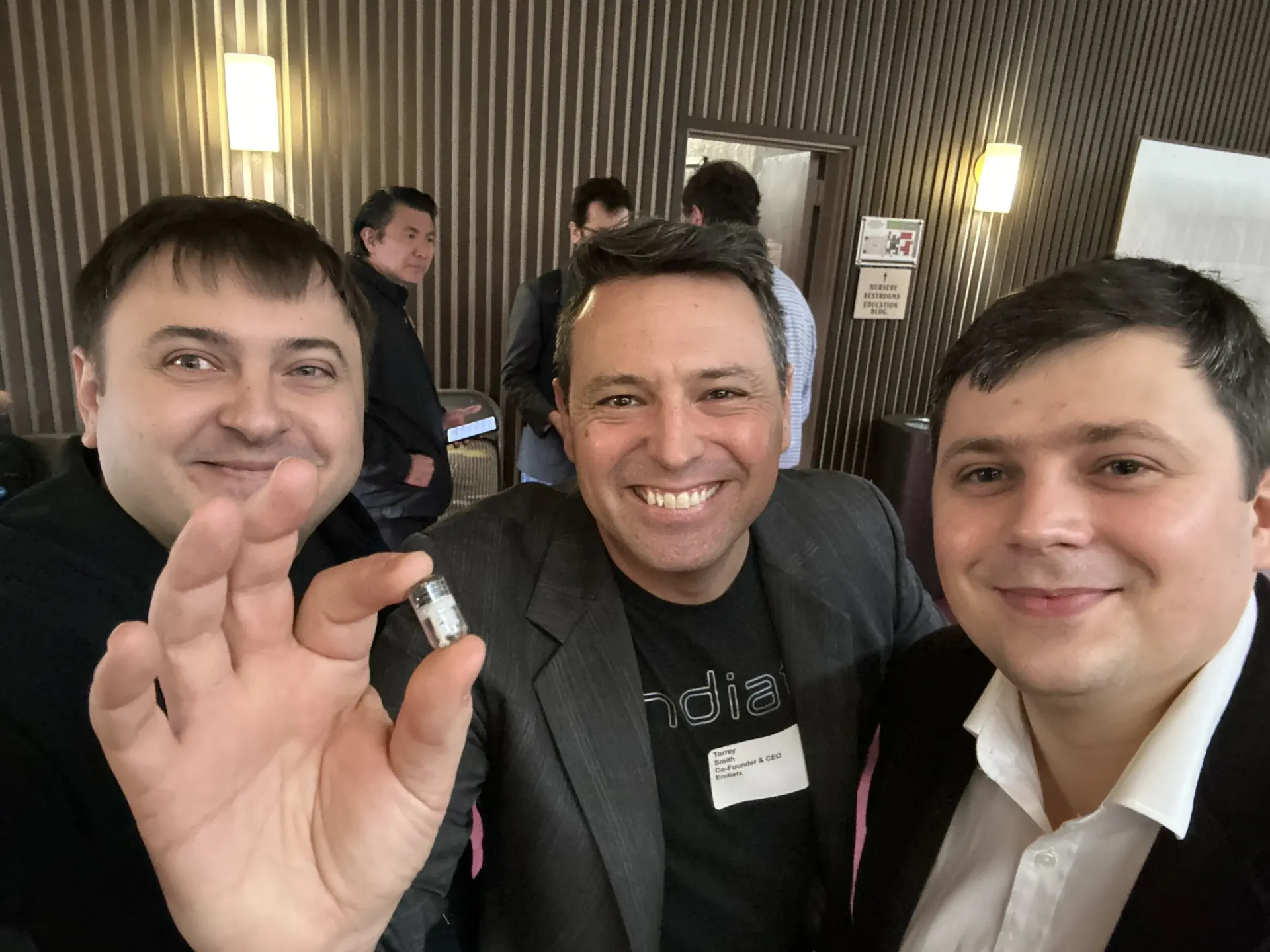 Oleg Sotnikov with medical-device startup founders at a pitch competition