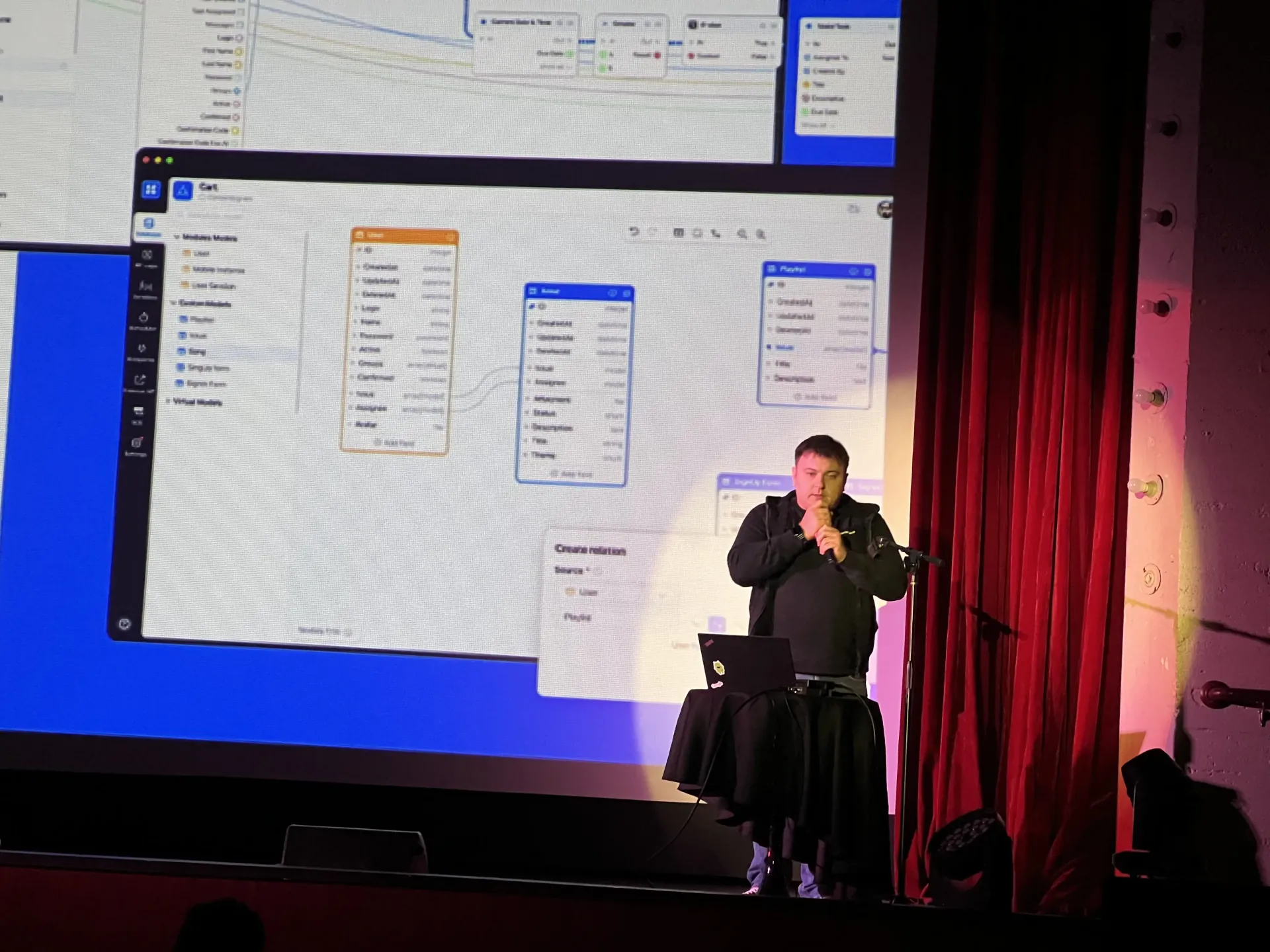Oleg Sotnikov pitching AppMaster on stage at the Great Star Theater in San Francisco's Chinatown