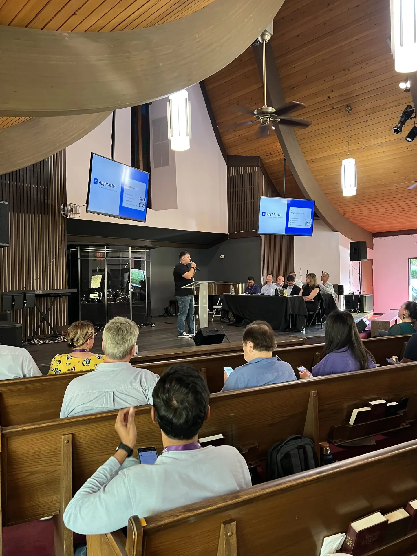 Oleg Sotnikov pitching AppMaster at a church venue in Palo Alto